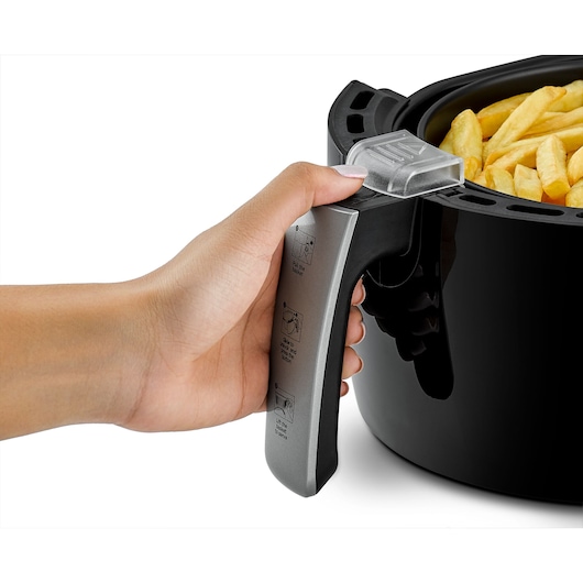 BLACKDECKER AF150 air fryer with fries, close-up of basket handle being held.