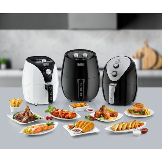 BLACKDECKER AF350 air fryers with assorted cooked foods, front angle, kitchen background.