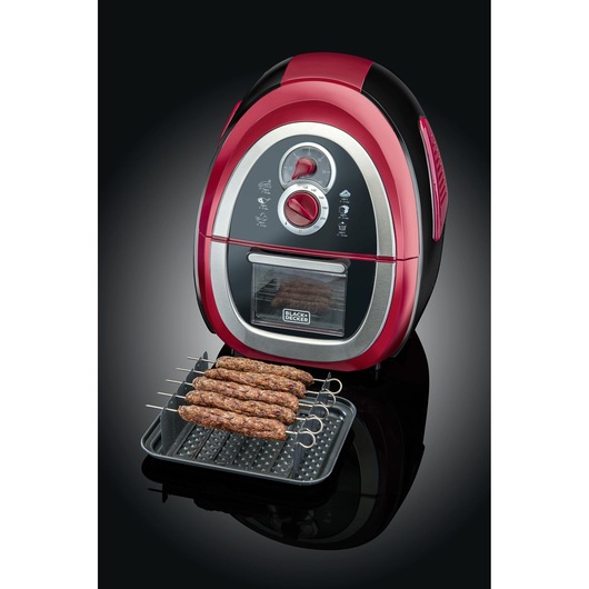 BLACK+DECKER AF500 air fryer, red and black, with control dials and cooking tray holding skewered kebabs, angled view.