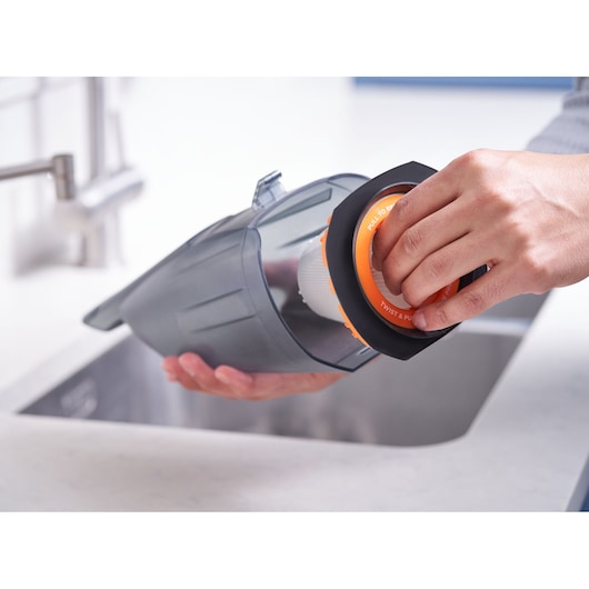 BLACKDECKER BCHV001C1 handheld vacuum filter removal, close-up by a sink.