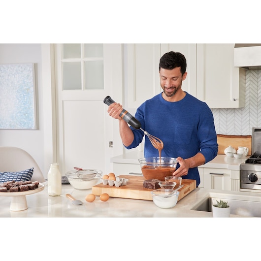 Photo of BLACKDECKER BCKM101WHFF hand mixer used for baking in a modern kitchen.
