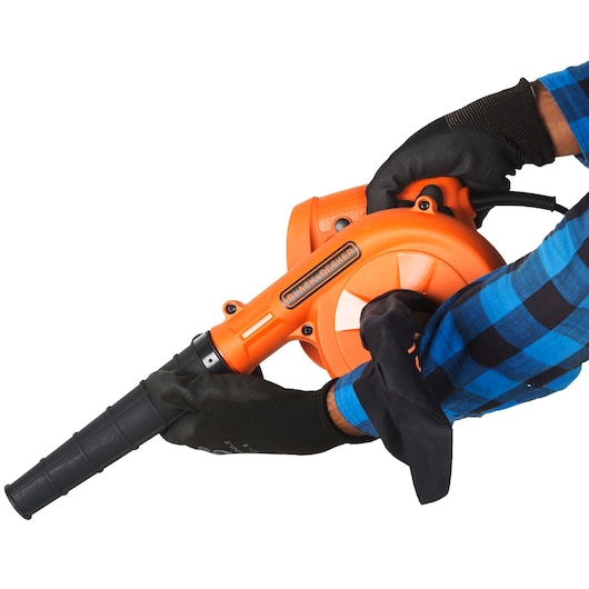 Photo of BLACKDECKER BDB530 orange handheld blower in use, black nozzle and grip, white background.