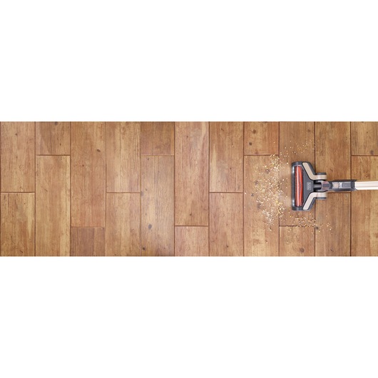 BLACKDECKER BHFEV36B2D stick vacuum cleaning debris on wooden floor, top view, product category Photography.