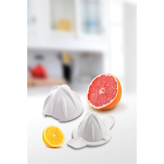 BLACKDECKER CJ800 citrus juicer accessories with sliced grapefruit and lemon on kitchen surface, front angle