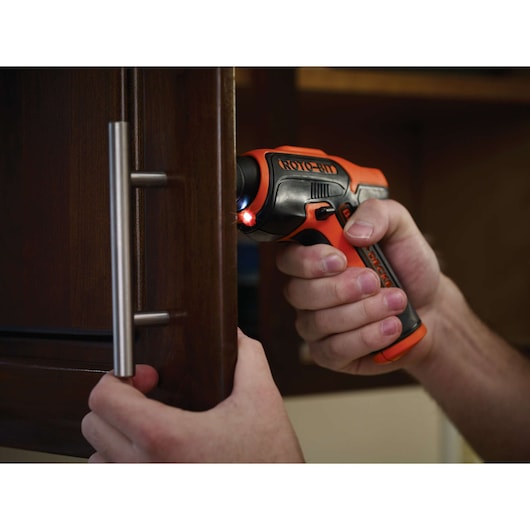 Photo of BLACKDECKER CS36BSCROTO cordless screwdriver being used to install a cabinet handle.