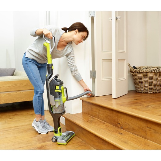 BLACKDECKER CUA525BHA upright vacuum cleaner with hose attachment cleaning wooden stairs indoors