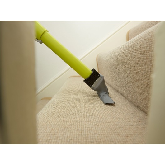 BLACKDECKER CUA525BHA vacuum cleaner brush cleaning carpeted stairs from side angle