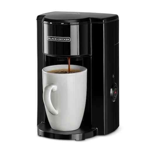 BLACKDECKER DCM25N compact black coffee maker brewing coffee into a white mug, front angle.