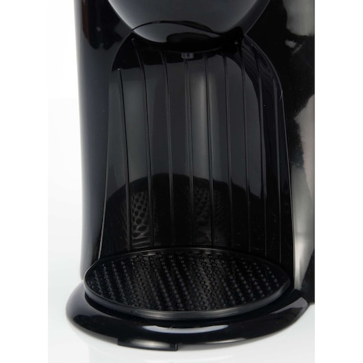 BLACKDECKER DCM25 coffee maker drip tray detail, black plastic, close-up, with textured surface.