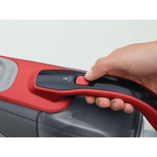 Photo of BLACKDECKER DVJ315J handheld vacuum cleaner handle, close-up on power button and ECO mode switch.