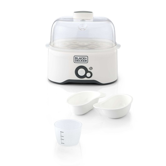 A BLACK+DECKER egg cooker with a transparent lid, white base, two white egg holders, and a clear measuring cup.