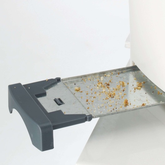 BLACKDECKER ET124 toaster crumb tray with crumbs, close-up angle, product photography.