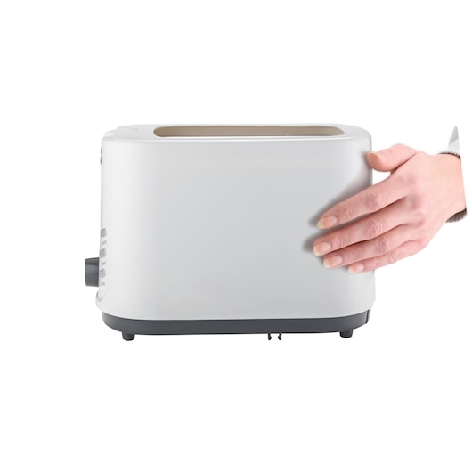 BLACKDECKER ET125 toaster side view with hand touching white body on white background.