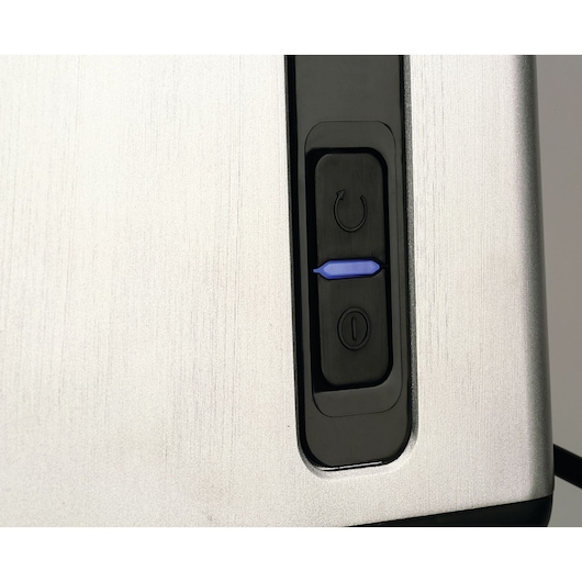 BLACKDECKER FM3000 toaster close-up showing silver body and black controls with blue button.