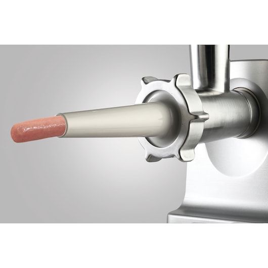 BLACKDECKER FM3000 meat grinder sausage attachment close-up, stainless steel with sausage casing.