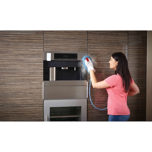 BLACKDECKER FSH10SMP steam cleaning glove used on kitchen appliance, action view.