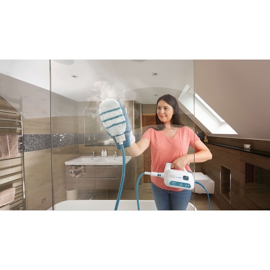 BLACKDECKER FSH10SM steam cleaning glove used on bathroom glass surface.