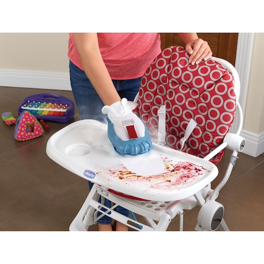 BLACKDECKER FSH10SM steam cleaning glove cleaning food stains on high chair tray, close-up angle.