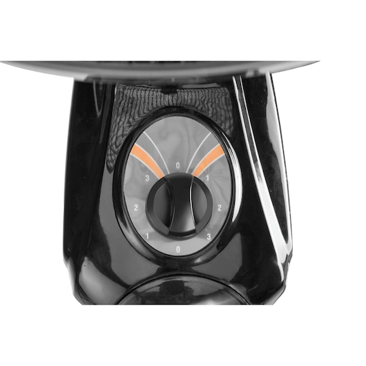 BLACK+DECKER FW1620 fan close-up, showing black control dial with numbers and orange accents, front angle.