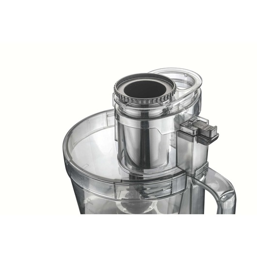 BLACKDECKER FX1050 food processor close-up with transparent lid and feeding tube, photographed from above on white background.
