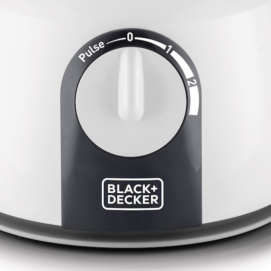 BLACK+DECKER FX1075 food processor front control dial with pulse and speed settings, close-up photo.