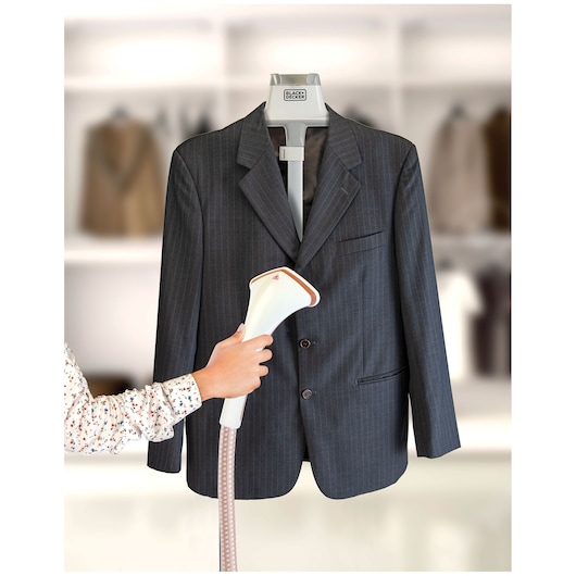 BLACKDECKER GST1600 clothes steamer used on a suit jacket, photography front angle.