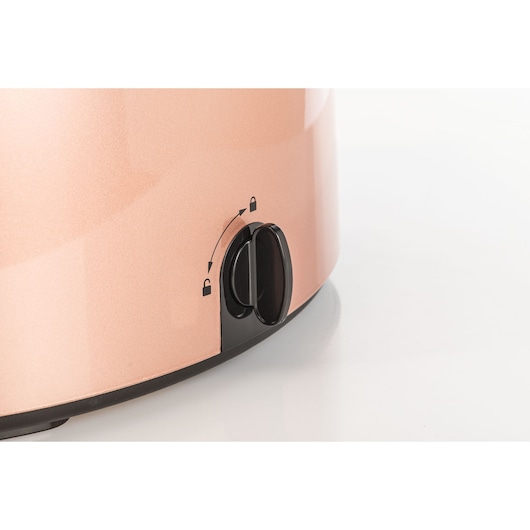 BLACKDECKER GST1600 kitchen appliance close-up, rose gold body with black lock control knob, front angle.