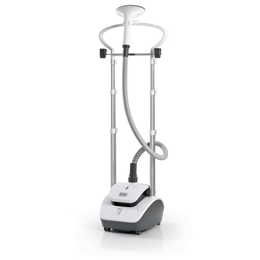 A BLACK+DECKER garment steamer model GST2000, shown upright with a hose, two vertical poles, and a hanger. The base features controls and the BLACK+DECKER logo. The device is designed for steaming clothes.
