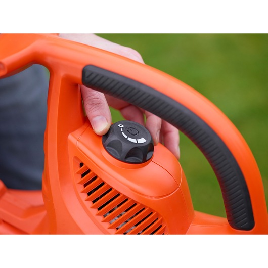 BLACKDECKER GW3031BP leaf blower handle and control knob close-up, orange and black outdoor tool.