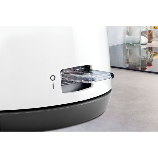 BLACKDECKER JC72 white appliance close-up showing power switch, on kitchen countertop.
