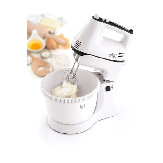 BLACKDECKER M700 white stand mixer with mixing bowl, photographed at front angle with baking ingredients in background.