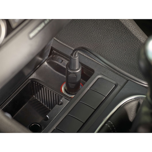 BLACKDECKER NV1210AV car vacuum power plug in vehicle cigarette lighter socket, close-up view.