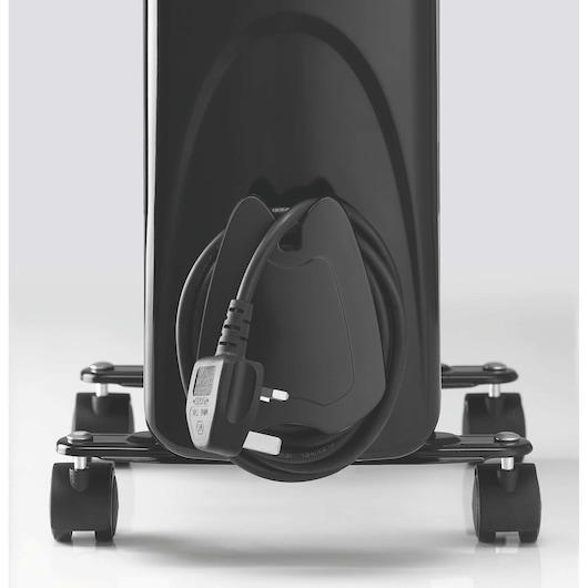 BLACKDECKER OR070D radiator close-up with cord and UK plug wrapped around holder, wheels visible, white background.