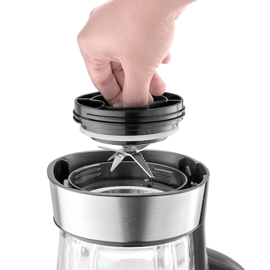 BLACKDECKER PB120 blender assembly close-up showing hand inserting blade unit into glass jar.