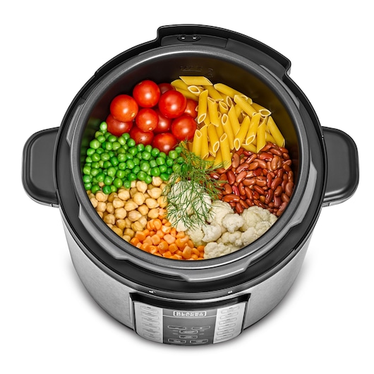 BLACKDECKER PCP1000 multicooker top view with tomatoes, penne pasta, peas, beans, chickpeas, carrots, and cauliflower.
