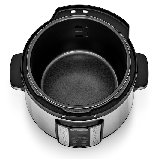 Photo of BLACKDECKER PCP1010 multi-cooker with open lid, showing non-stick inner pot and control panel, top angle.