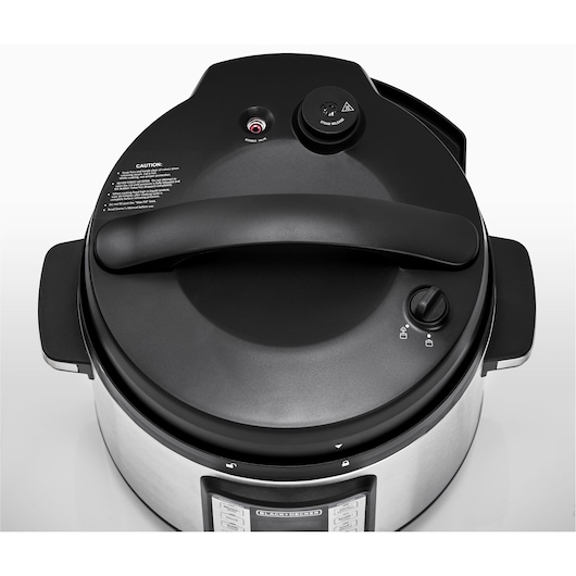 BLACKDECKER PCP1010 stainless steel pressure cooker top view, visible control knob, steam release valve, and handle.
