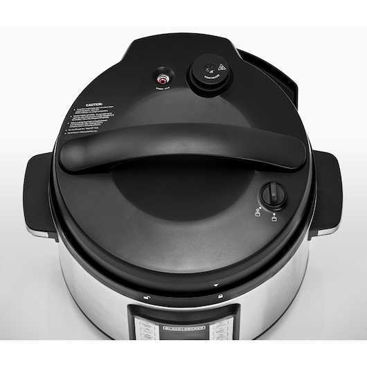 Photo of BLACKDECKER PCP1010 stainless steel electric pressure cooker, top view showing black lid with safety valve.