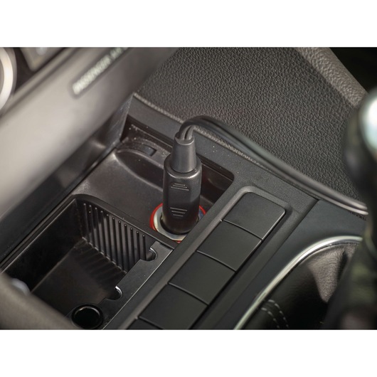 BLACKDECKER PD1200AV car vacuum adapter plugged into car power outlet, close-up view.