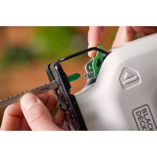 Photo of BLACK+DECKER REVJ12C jigsaw close-up, showing blade being inserted into the tool.
