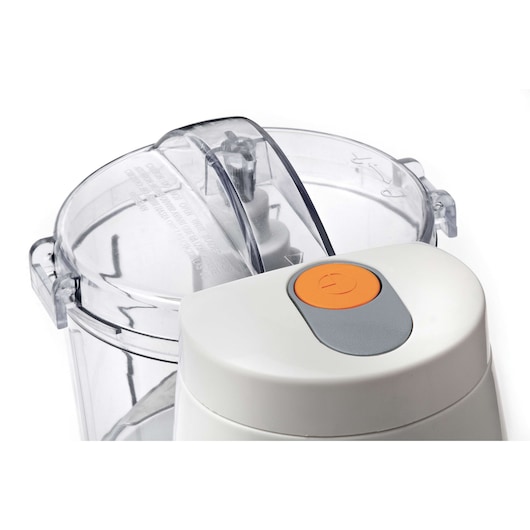Photo of BLACKDECKER SC350 food processor with white body, transparent bowl, and orange power button, side angle.