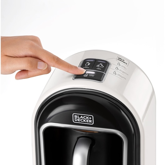 BLACKDECKER TCM730 coffee maker button pressed, close-up, white and black finish, front angle.