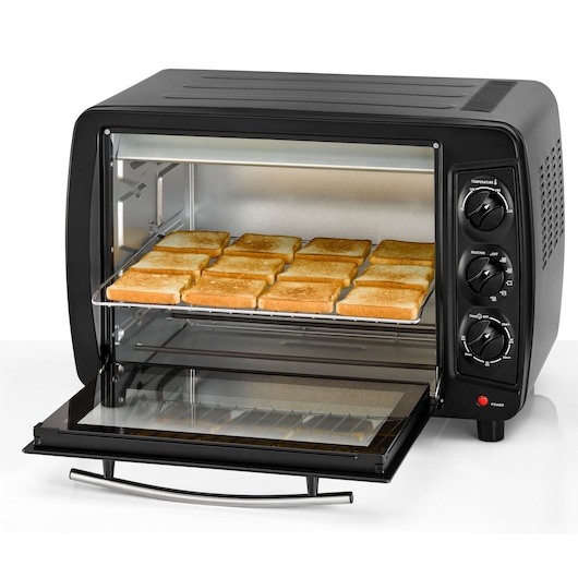 BLACKDECKER TRO35RDG black toaster oven on white background, front angle, with door open and twelve slices of toasted bread inside.