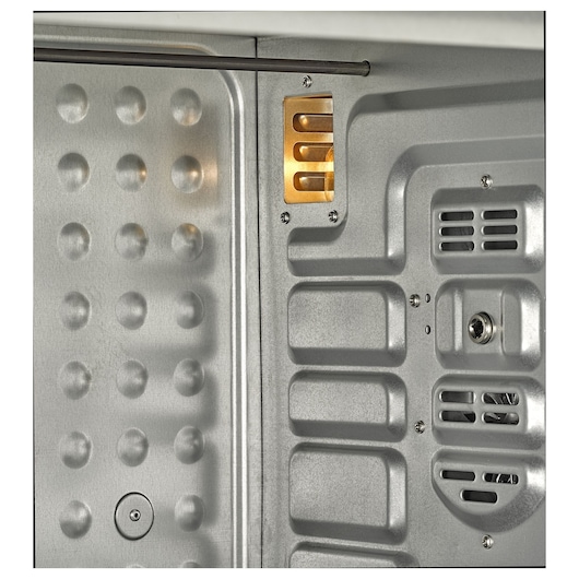 BLACKDECKER TRO55RDG oven interior close-up showing light and metallic textured walls.