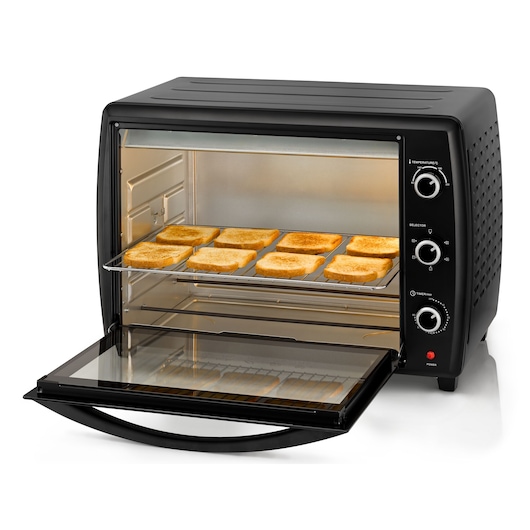BLACKDECKER TRO70RDG toaster oven, black, side angle, with toasted bread slices on rack.