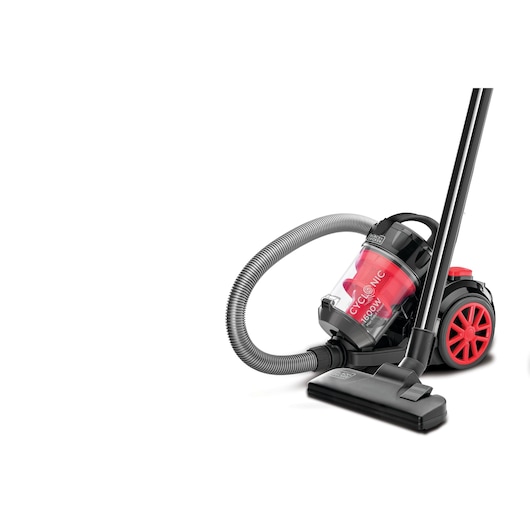 A BLACK+DECKER cyclonic vacuum cleaner with a transparent dust container, black and red design, hose and floor nozzle attachment.