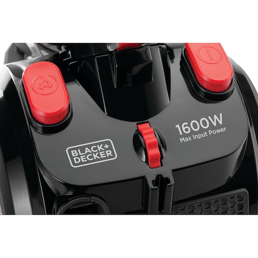 Close-up of a BLACK+DECKER vacuum cleaner model VM1680, showing the control buttons, the brand logo, and 1600W max input power specification on the top surface.