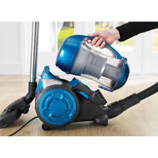 BLACKDECKER VM2825 canister vacuum cleaner with blue accents, dust container being removed, close-up view.