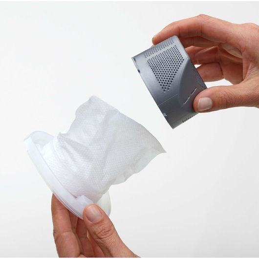Photo of hands assembling BLACK+DECKER WDB115WA vacuum filter and gray filter cover on white background.
