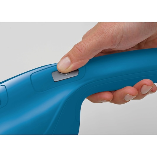 Close up of BLACKDECKER WDB215WA blue plastic handle with on/off switch, hand pressing the button.